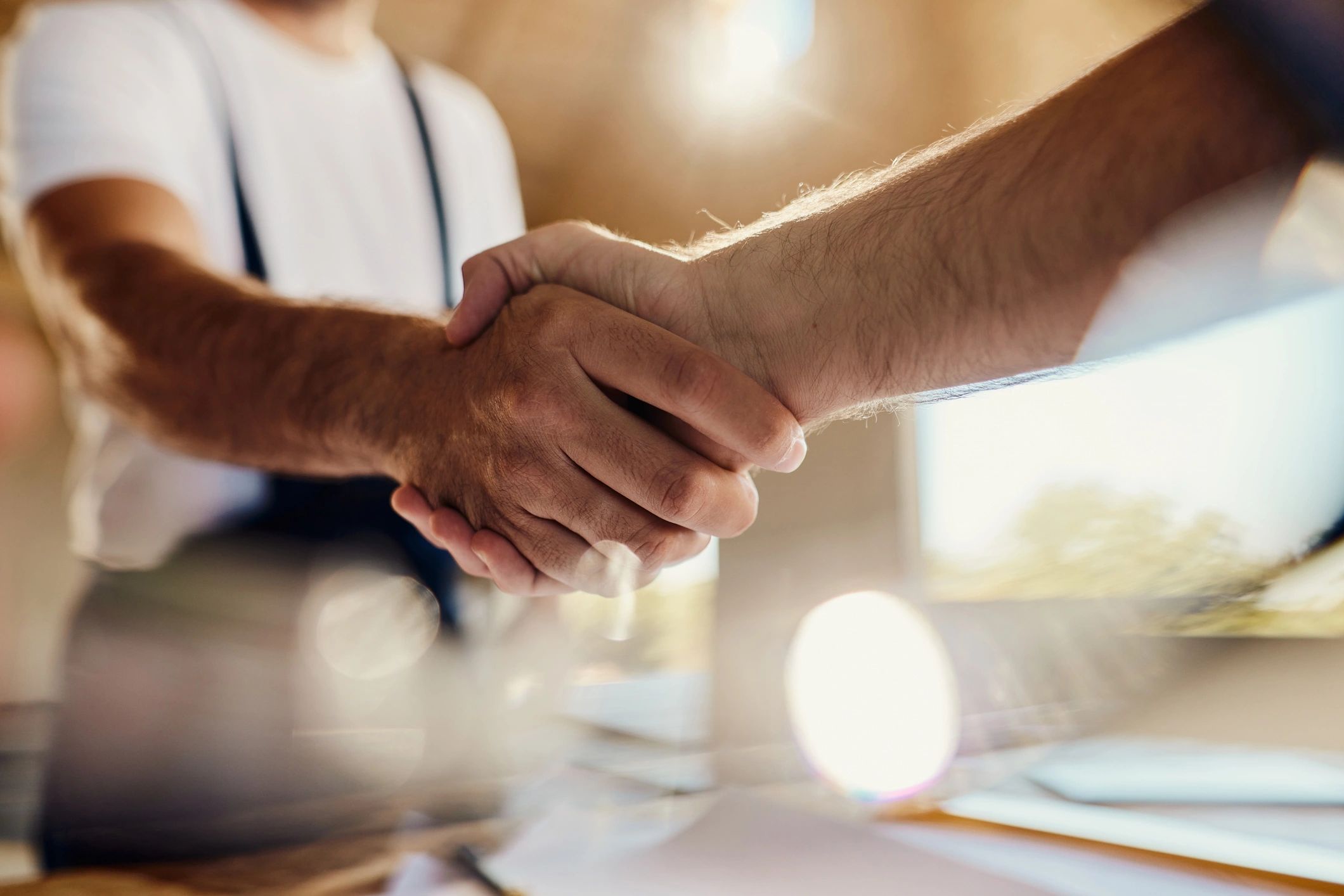Handshake to finalize a real estate agreement