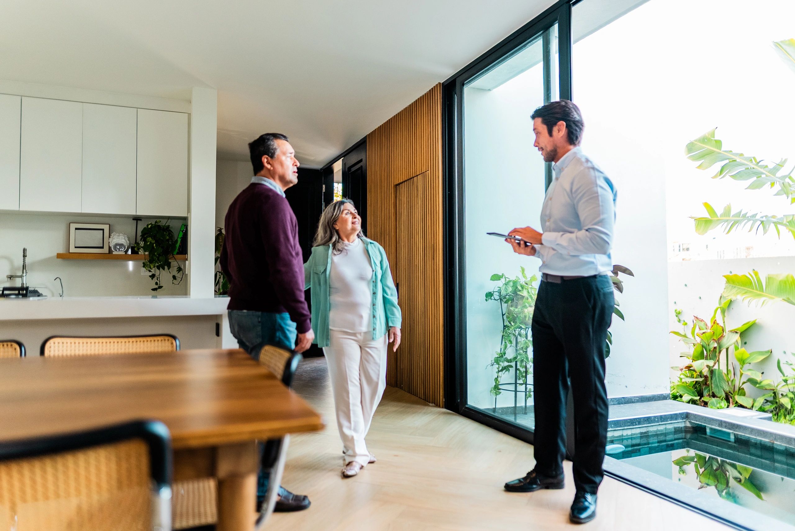 Real estate agent showing a home to a couple